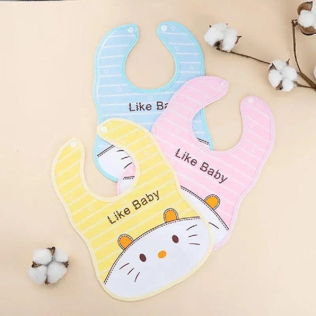 Three colorful baby bibs with cartoon cat design and 'Like Baby' text on a beige background.